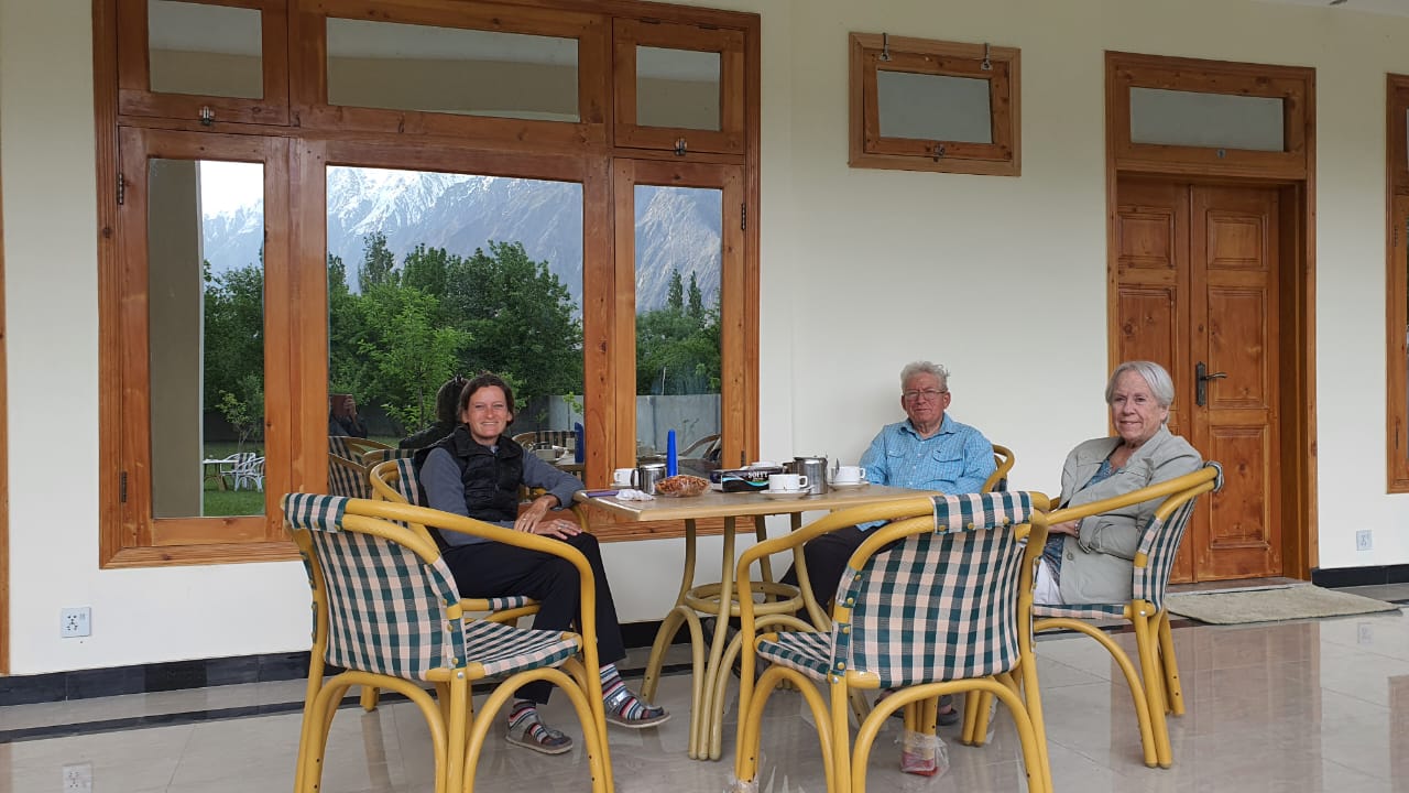 Guests drinking tea on veranda